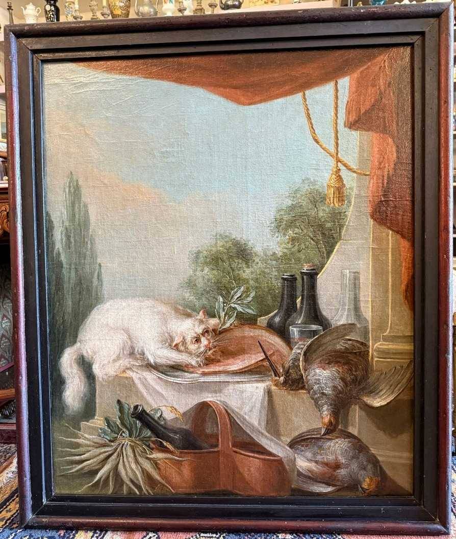 Grande nature morte au buffet un chat dévorant le  jambon école française du XVIIIème siècle.